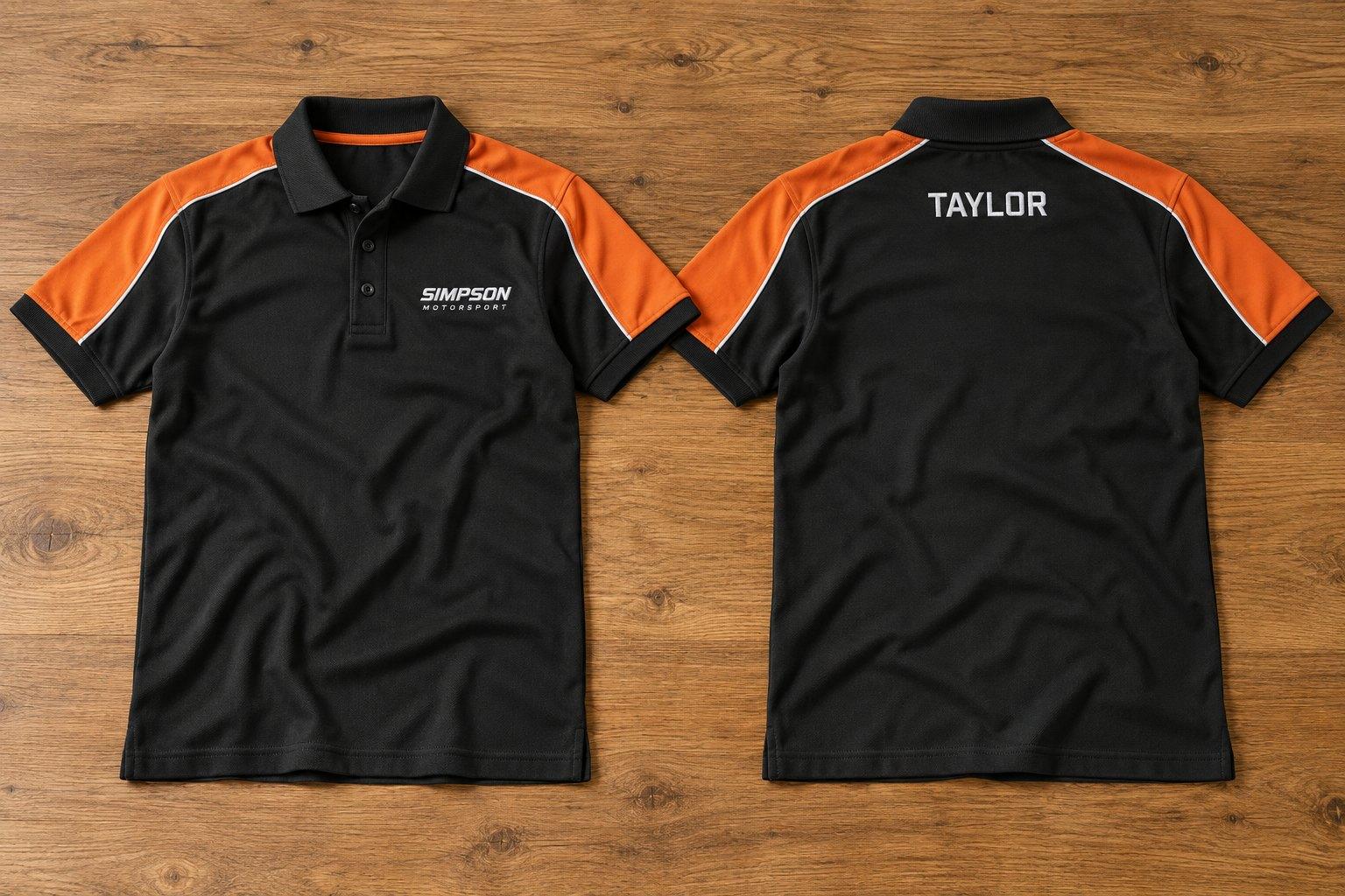 Black polo with orange shoulder panels and white piping, Simpson Motorsport logo on the chest and a name across the back