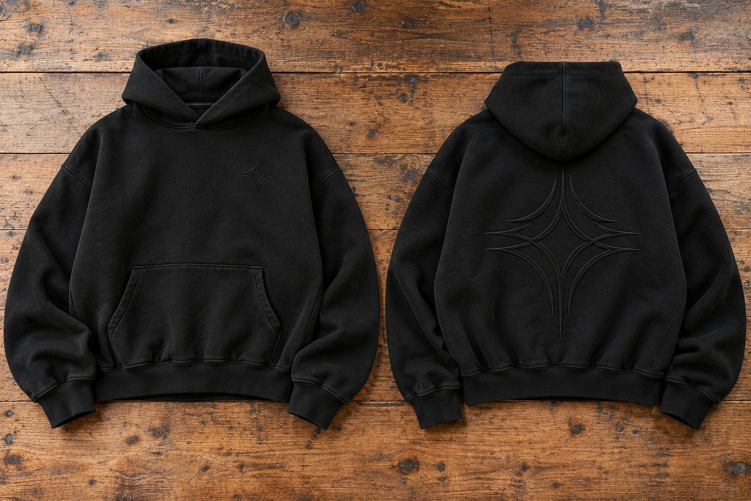 Black oversized hoodie, front and back, with a tonal star on the chest and a large one across the back