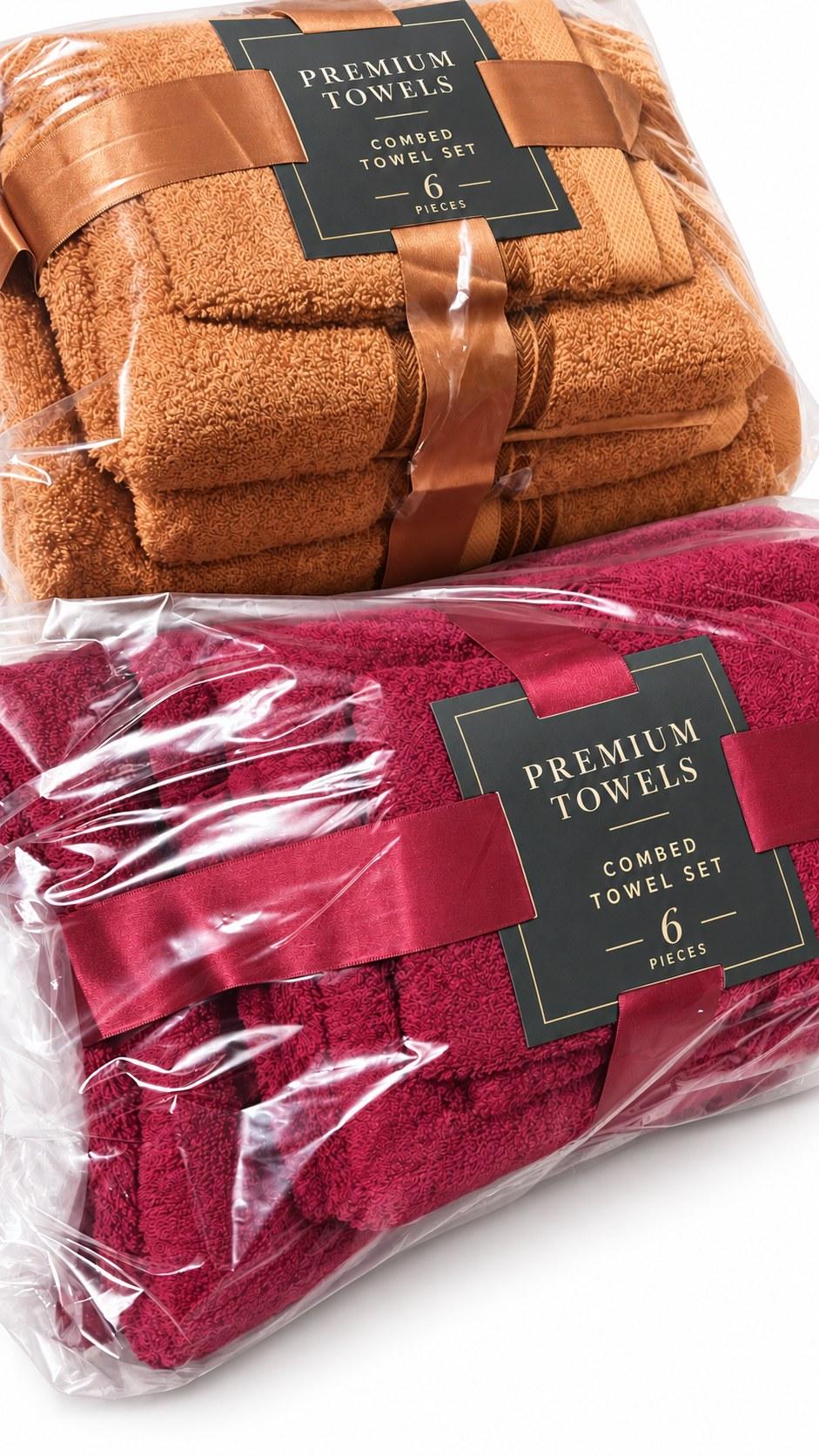 Two combed cotton 6-piece towel sets, in tan and burgundy, packed in clear bags with satin ribbon and a Premium Towels card