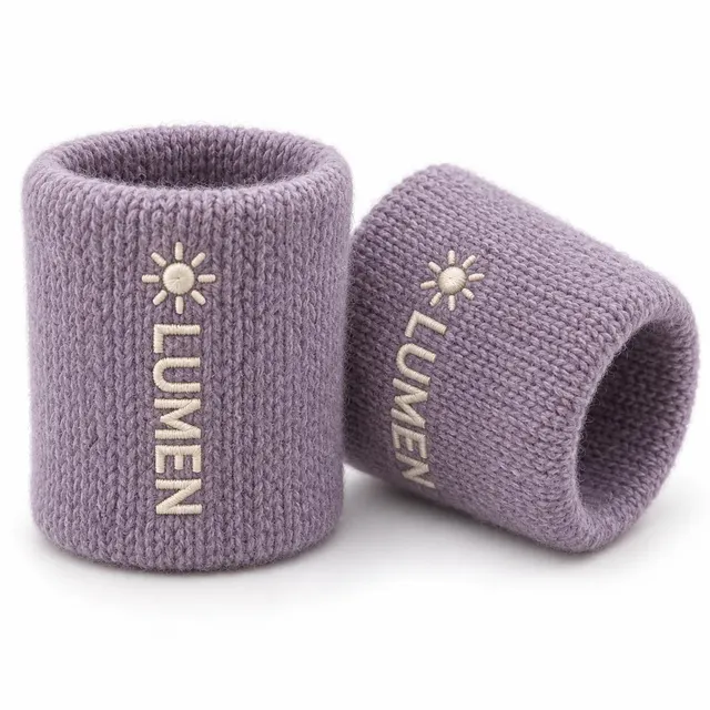 Lilac woolen wristbands with an ivory wordmark and sun logo embroidered vertically